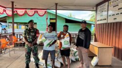 Babinsa Koramil 1710-01/Kokonao Dampingi Penyaluran Beras Ketahanan Pangan Untuk Masyarakat